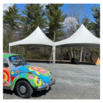 Colorful Car in Front of Tents